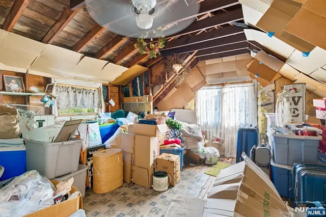 a view of a room with lots of furniture and a chandelier