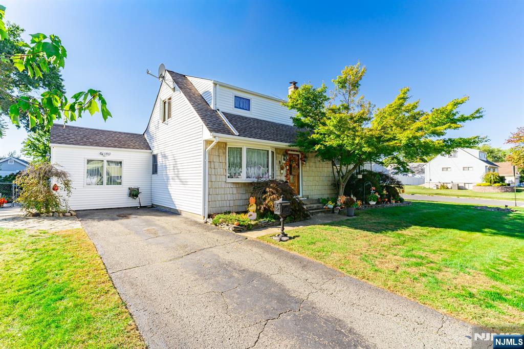 8 Lynn Boulevard Hazlet, NJ 07730 - Photo 2 of 25 a front view of a house with garden