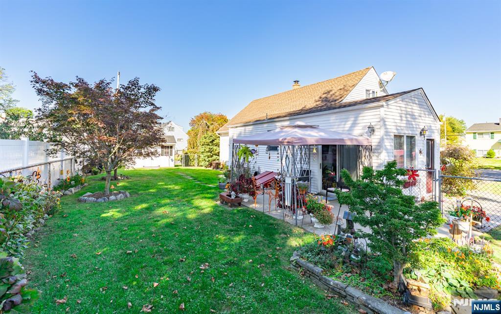 8 Lynn Boulevard Hazlet, NJ 07730 - Photo 25 of 25 a view of a house with a backyard and a patio