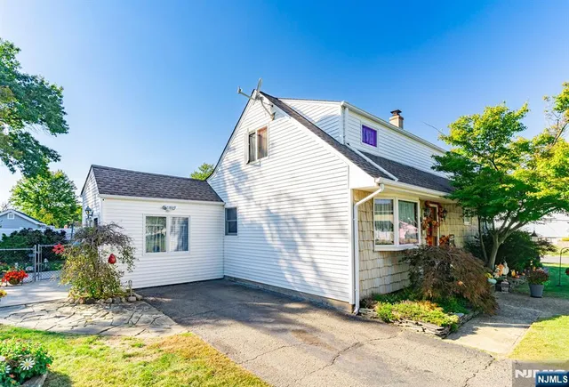 a view of house with backyard