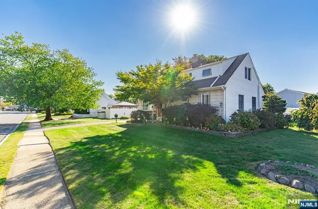 a house with swimming pool in front of it