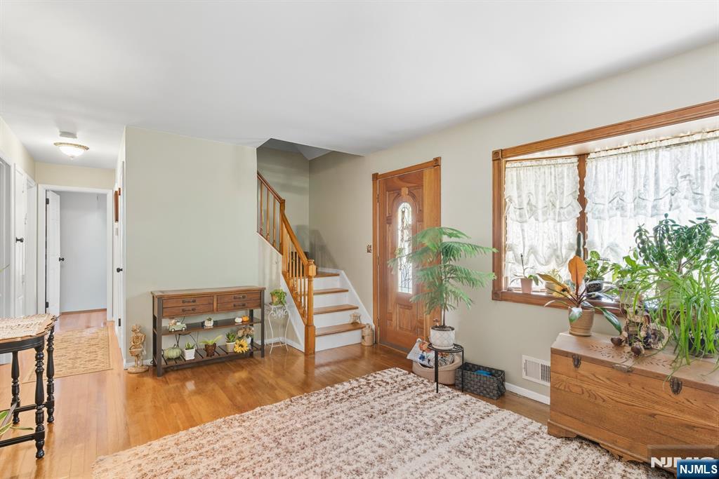 8 Lynn Boulevard Hazlet, NJ 07730 - Photo 7 of 25 a living room with furniture and a wooden floor