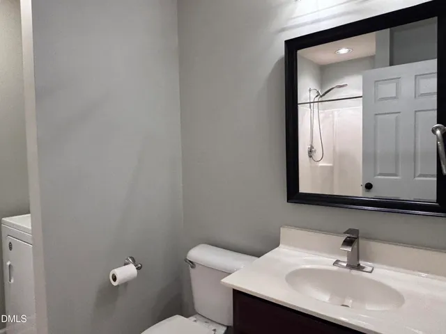 a view of an empty room and a window