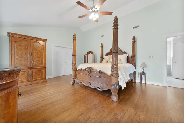 a bed room with furniture and wooden floor