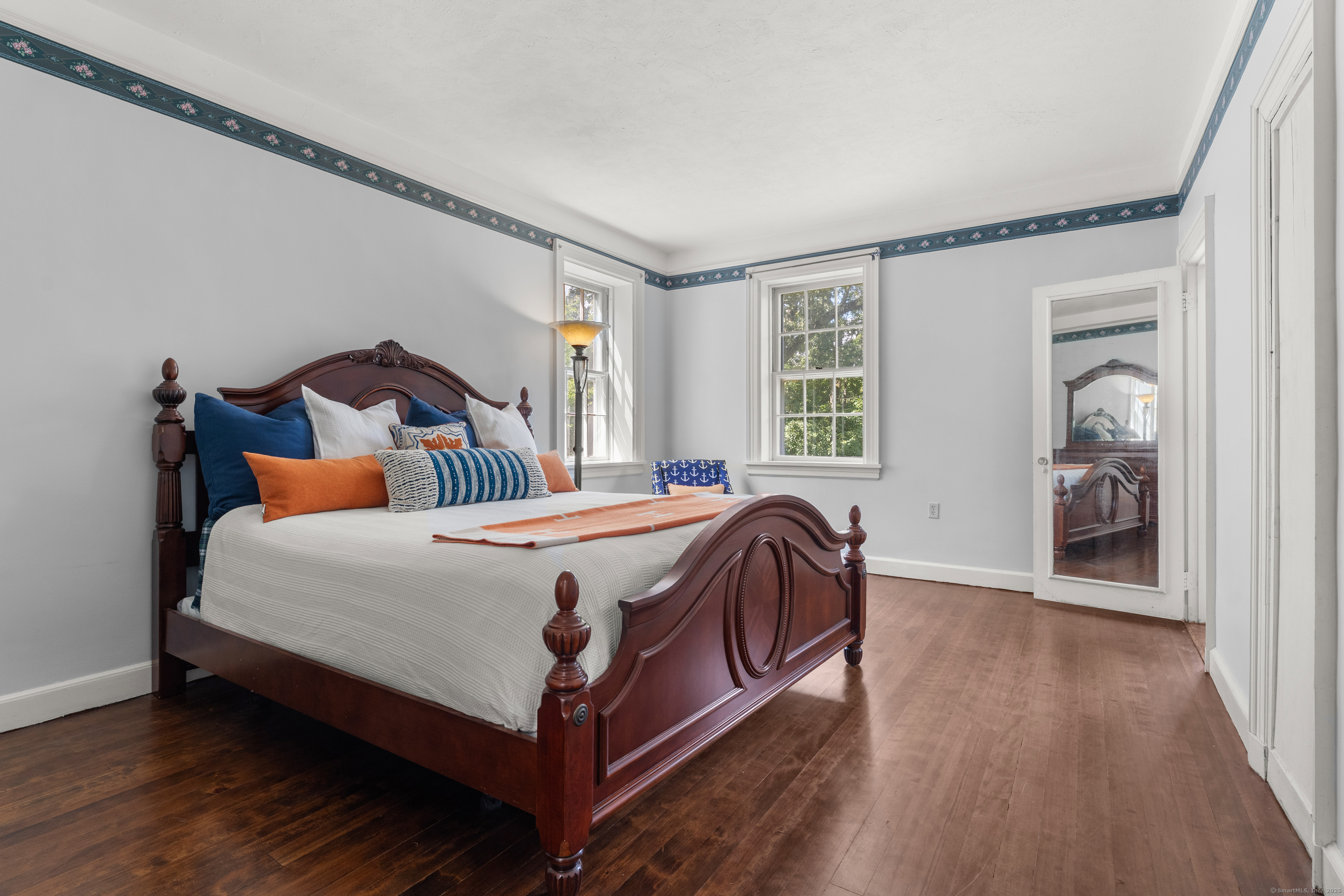 62 Big Bear Hill Road New Milford, CT 06776 - Photo 20 of 40 a bed sitting in a bedroom next to a window and a wooden floor