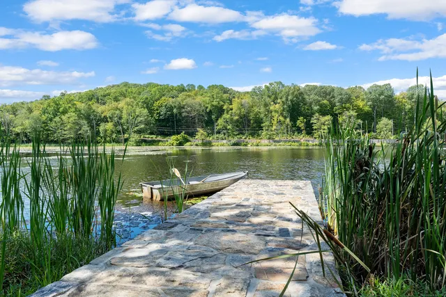 a view of a lake with a big yard