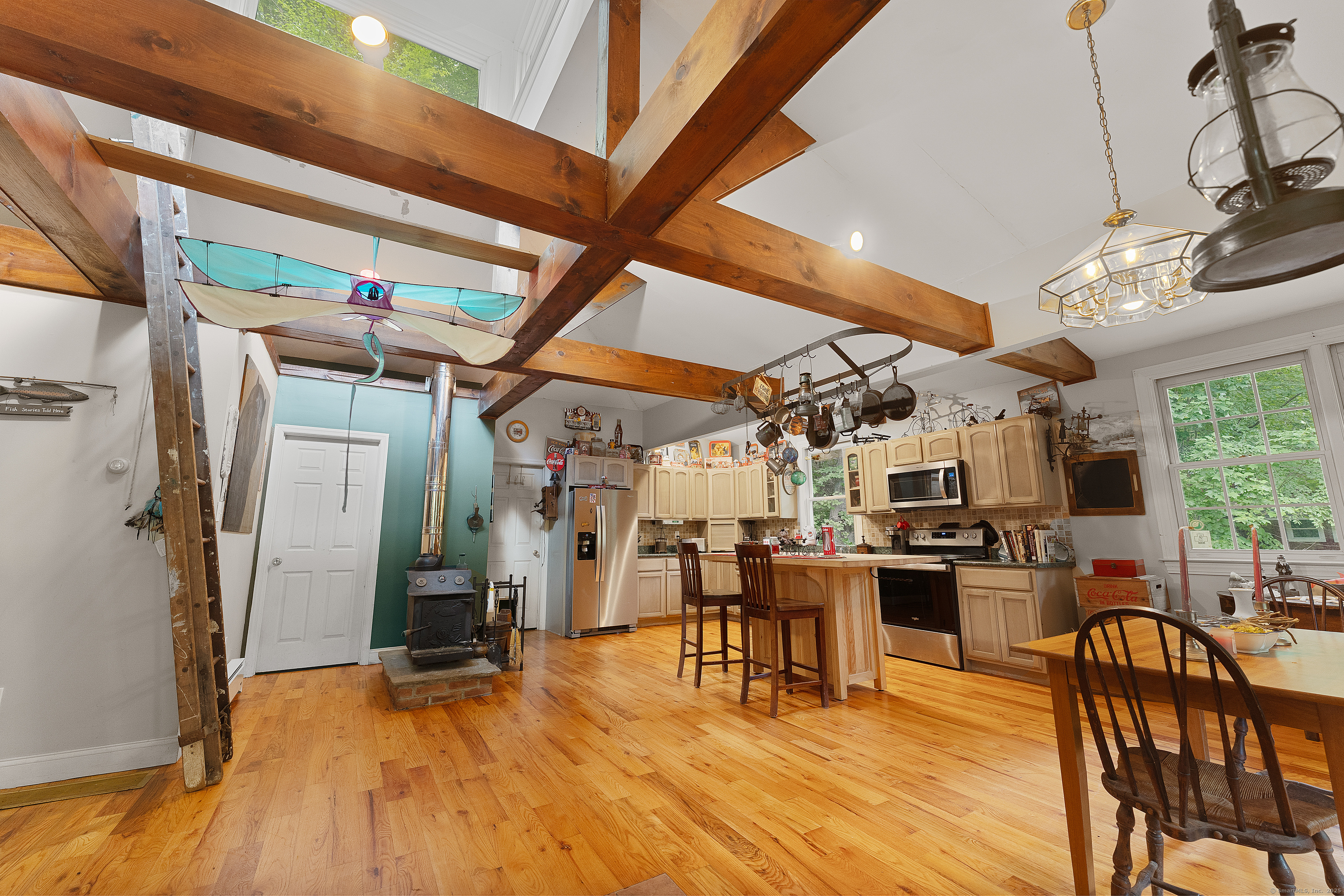 62 Big Bear Hill Road New Milford, CT 06776 - Photo 30 of 40 a view of a dining room with furniture window and wooden floor