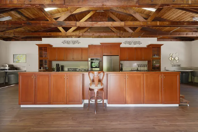 a view of a room with wooden floor