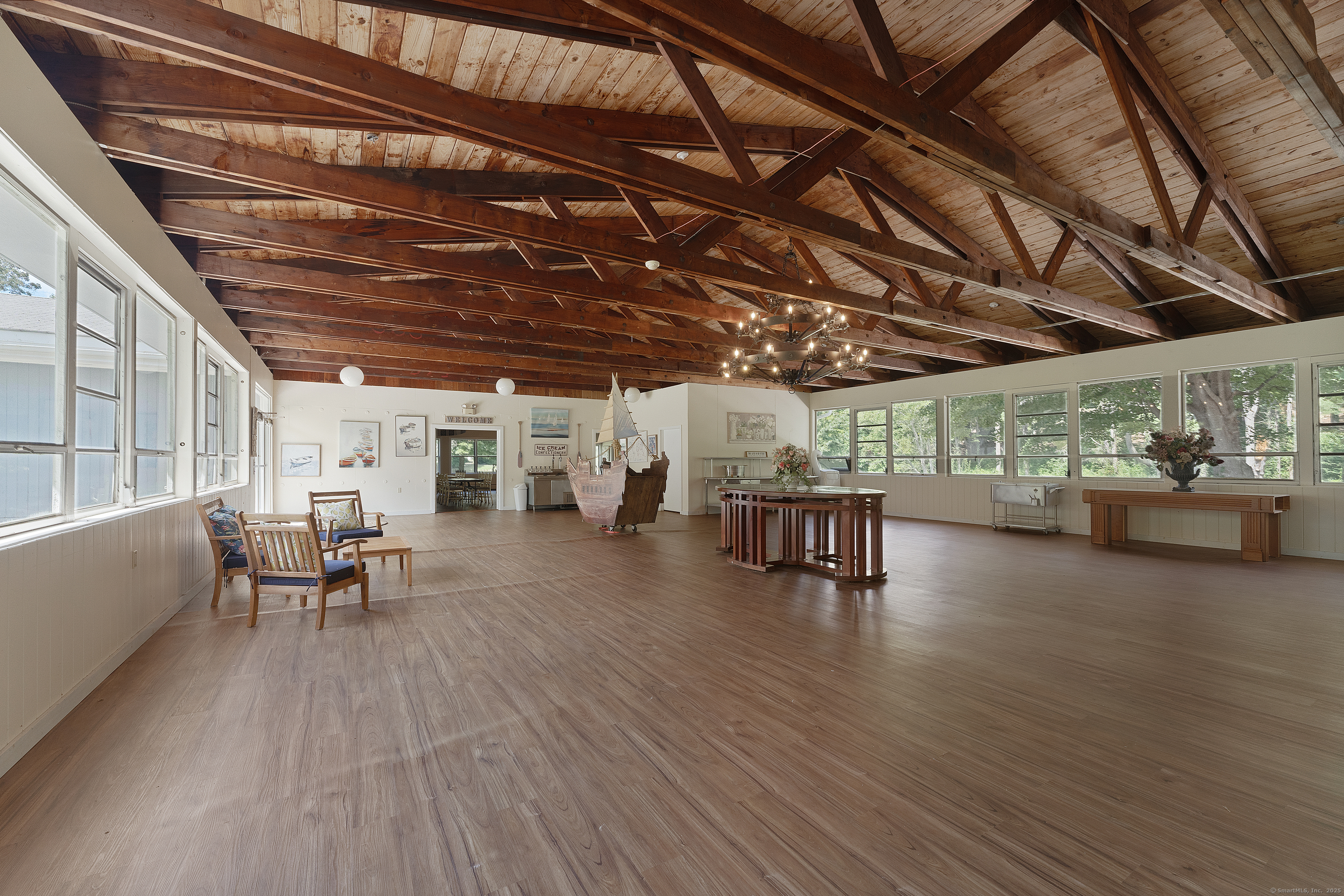 62 Big Bear Hill Road New Milford, CT 06776 - Photo 33 of 40 a view of a patio with table and chairs with wooden floor