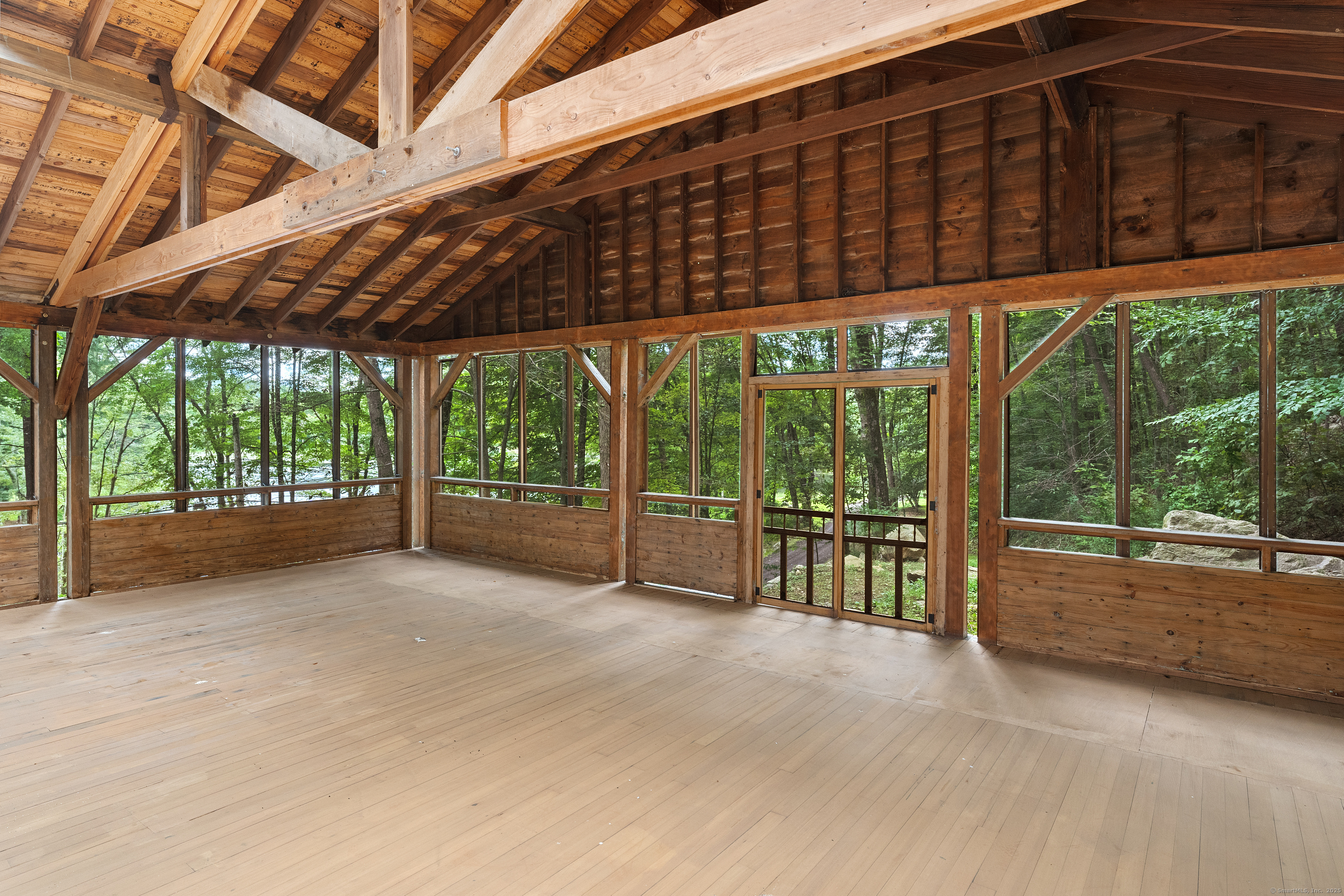 62 Big Bear Hill Road New Milford, CT 06776 - Photo 38 of 40 a backyard of a house with a garden and outdoor seating