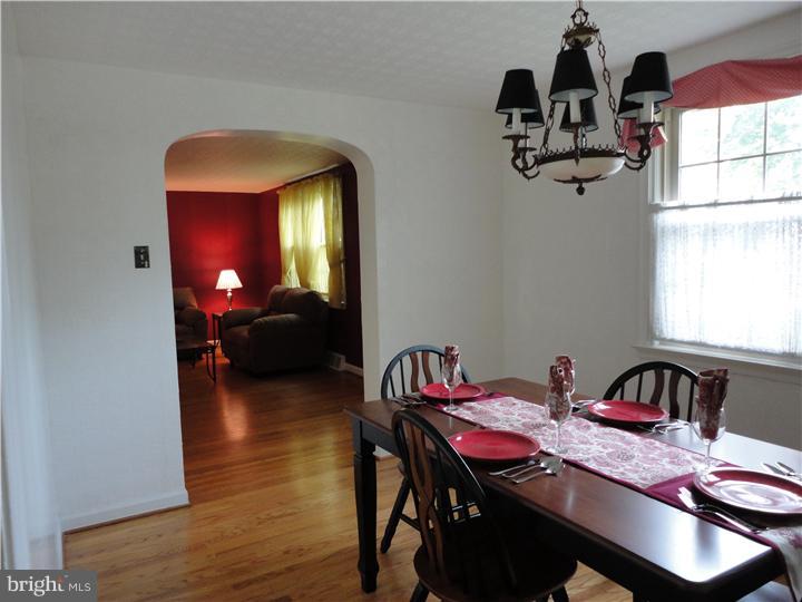 642 Dutton Circle Springfield, PA 19064 - Photo 13 of 25 a view of a dining room with furniture and chandelier
