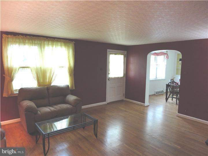 642 Dutton Circle Springfield, PA 19064 - Photo 17 of 25 a living room with furniture and a large window