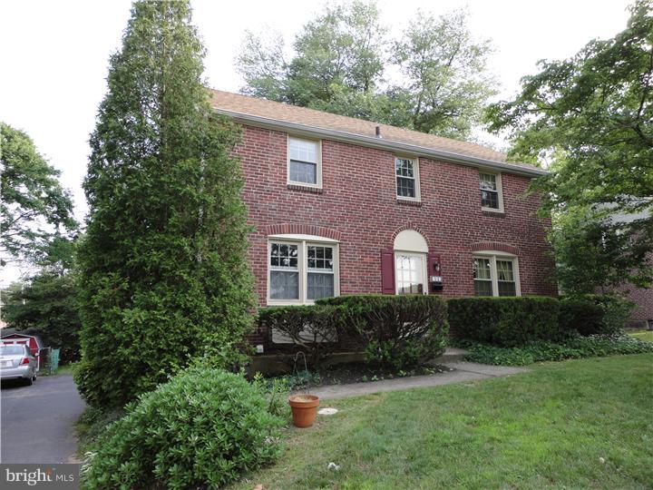 642 Dutton Circle Springfield, PA 19064 - Photo 5 of 25 a front view of a house with a yard and trees