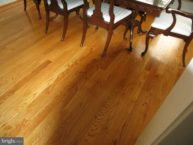 a kitchen with wooden cabinets and a stove top oven