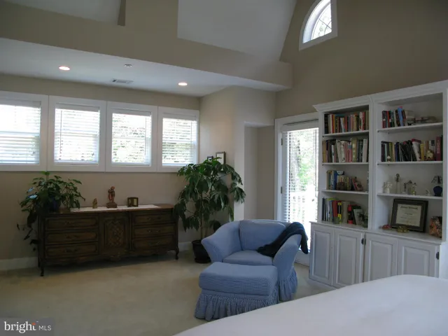 a bathroom with a shower sink and mirror