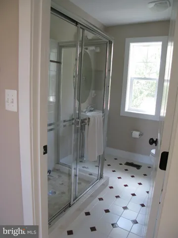 a living room with furniture and a bath tub