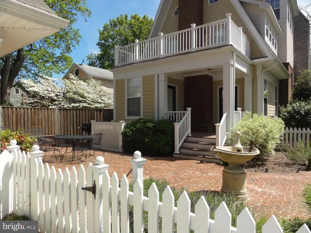 a view of a chair and table in backyard