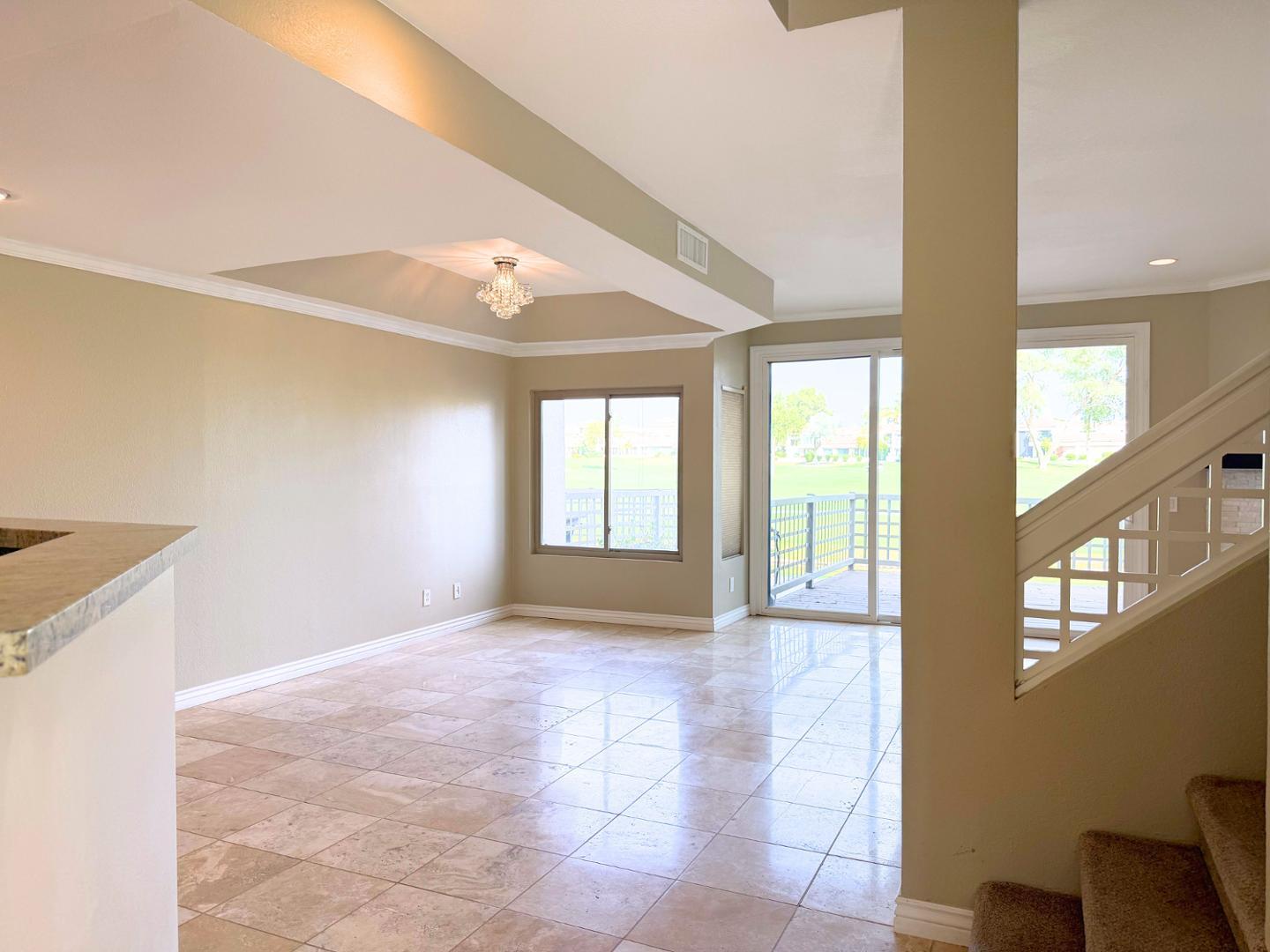 7272 East Gainey Ranch Road, Unit 19 Scottsdale, AZ 85258 - Photo 4 of 13 a view of an empty room with a window