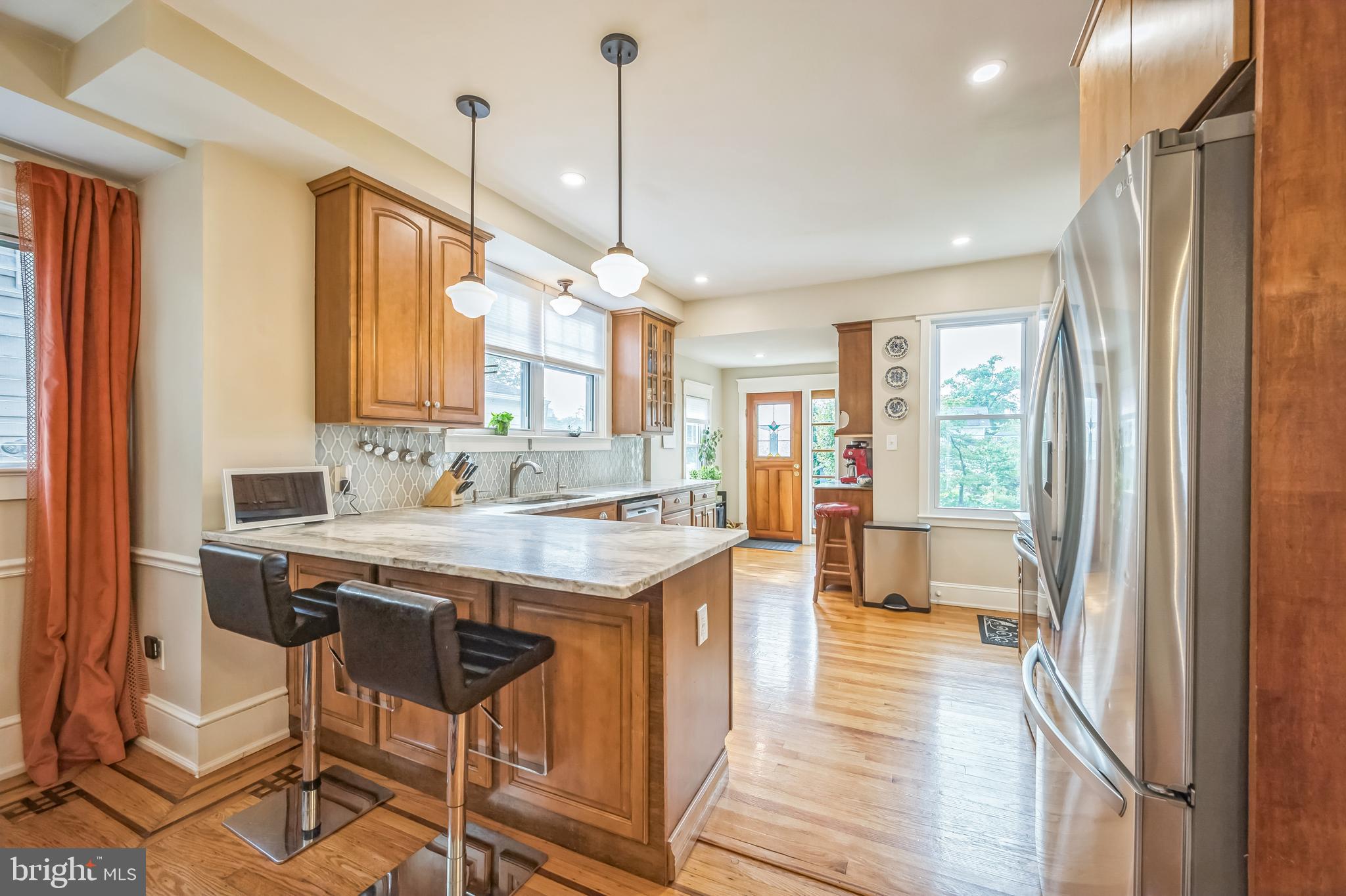 35 Harvard Road Audubon, NJ 08106 - Photo 13 of 36 a view of a kitchen with kitchen island granite countertop a sink and a refrigerator