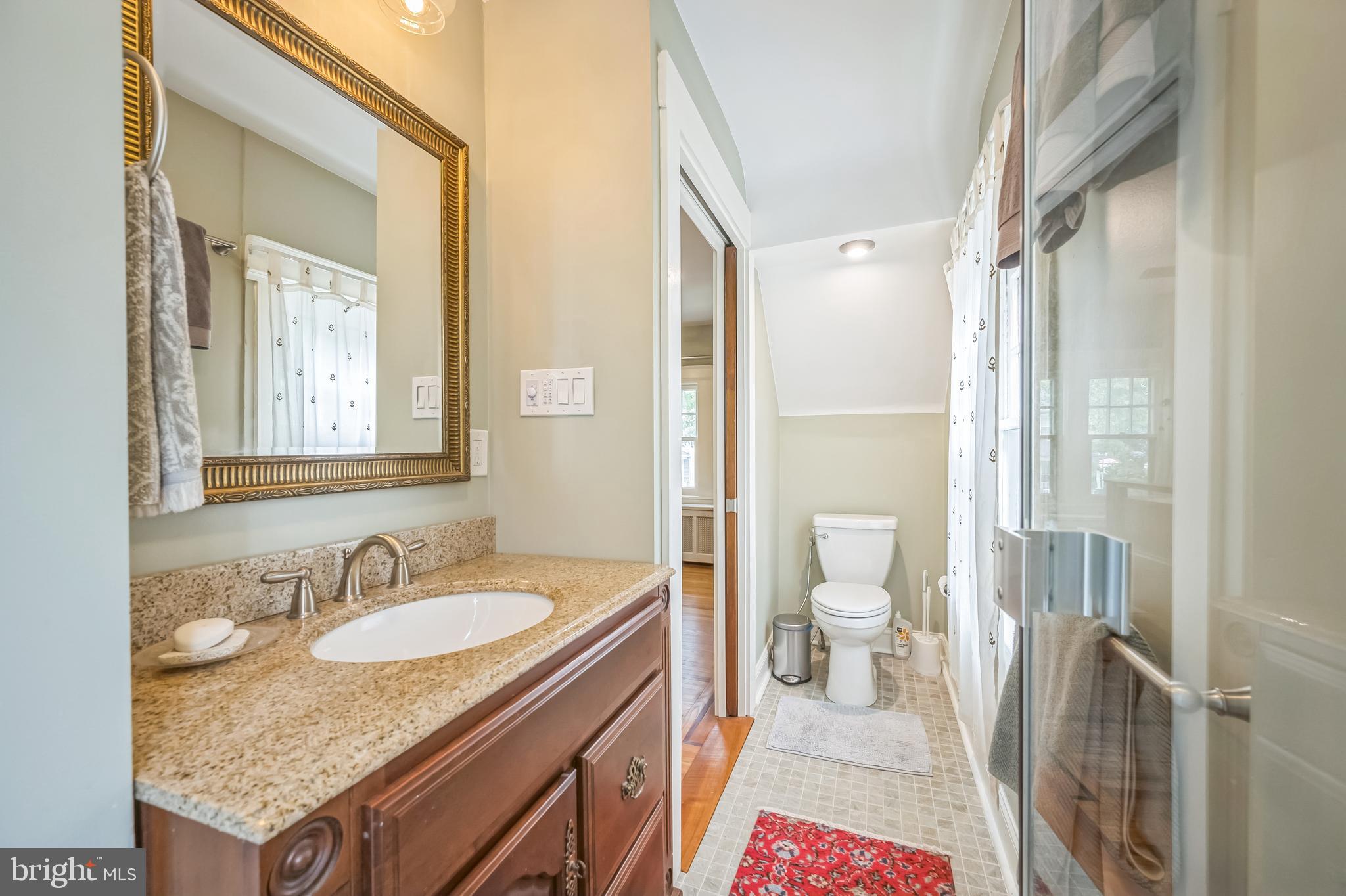 35 Harvard Road Audubon, NJ 08106 - Photo 22 of 36 a spacious bathroom with a granite countertop sink and a mirror