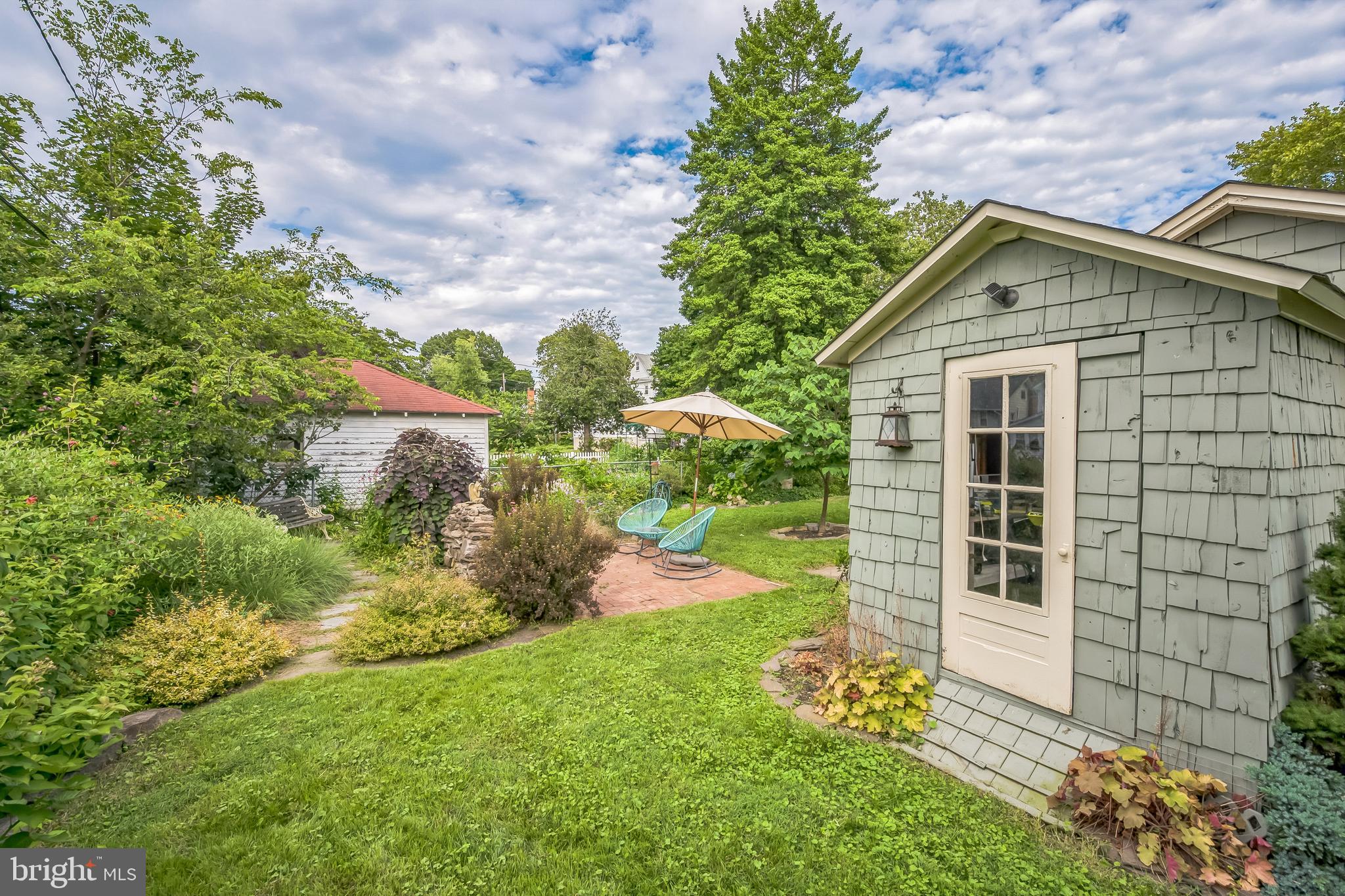 35 Harvard Road Audubon, NJ 08106 - Photo 35 of 36 a house with garden in front of it
