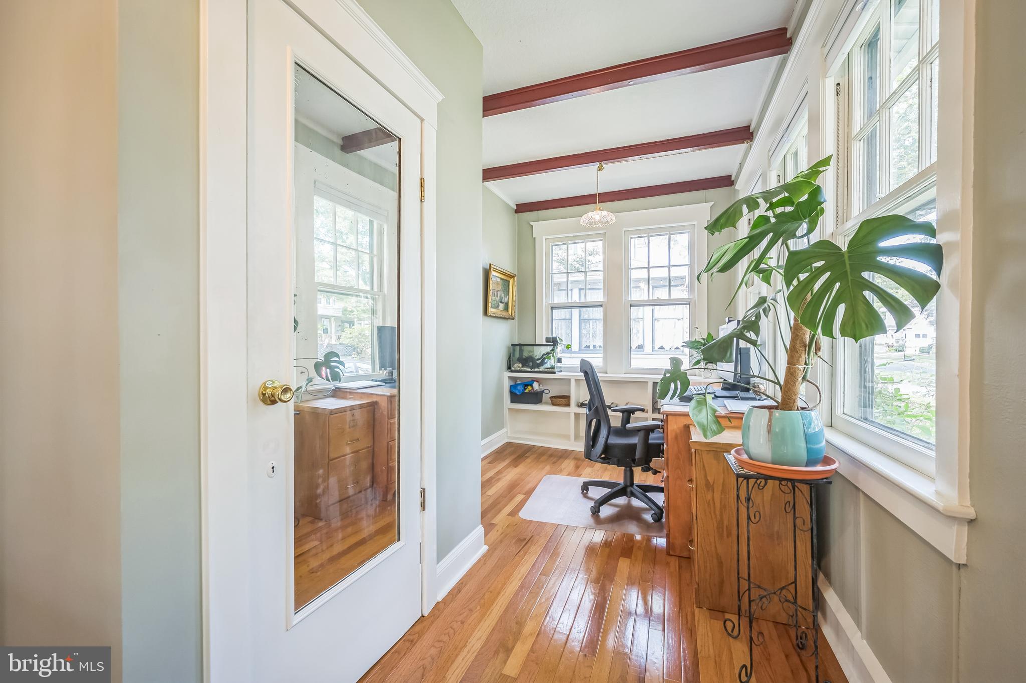 35 Harvard Road Audubon, NJ 08106 - Photo 5 of 36 a living room with furniture and a large window with wooden floor