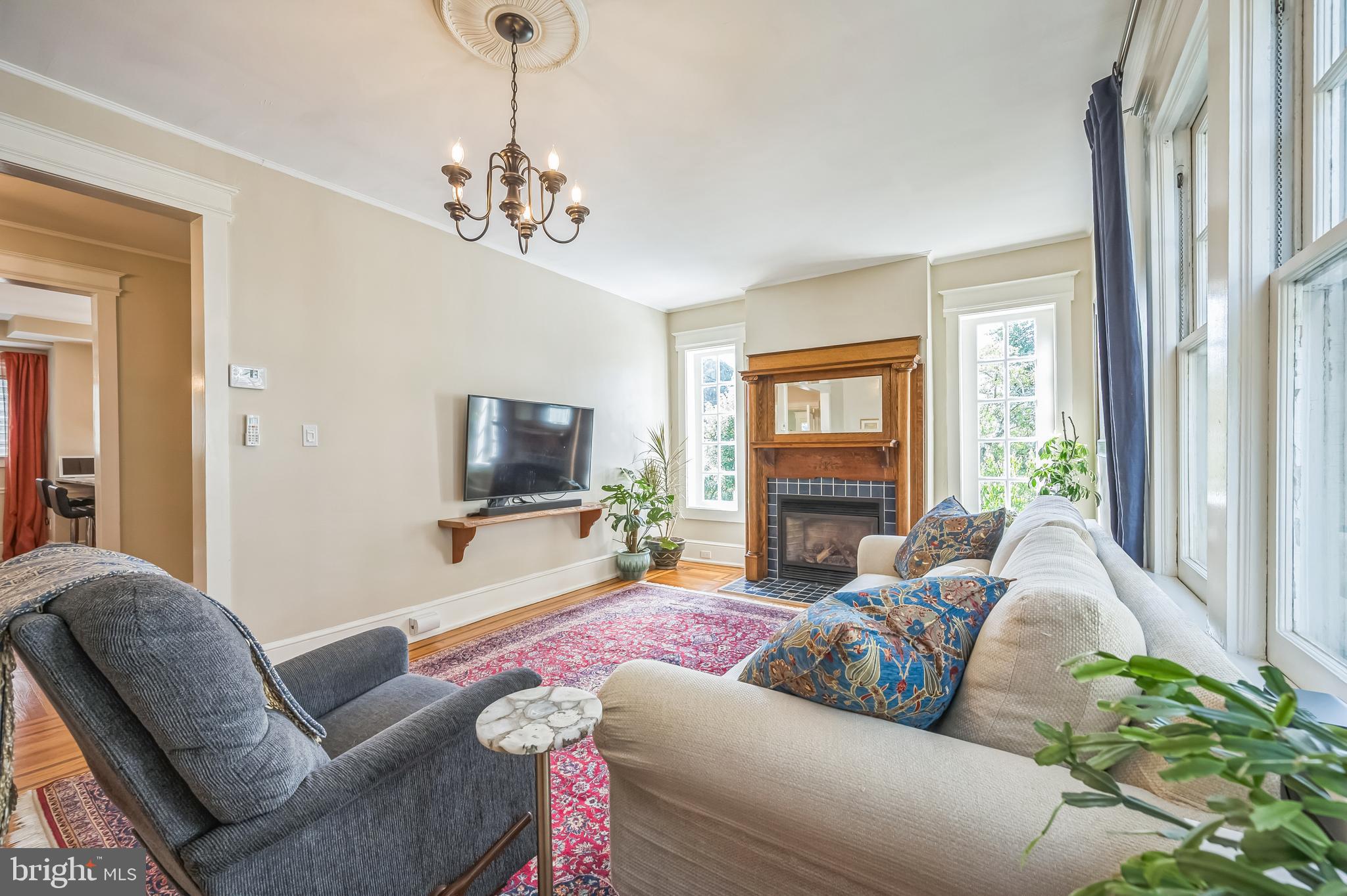 35 Harvard Road Audubon, NJ 08106 - Photo 9 of 36 a living room with furniture and a flat screen tv