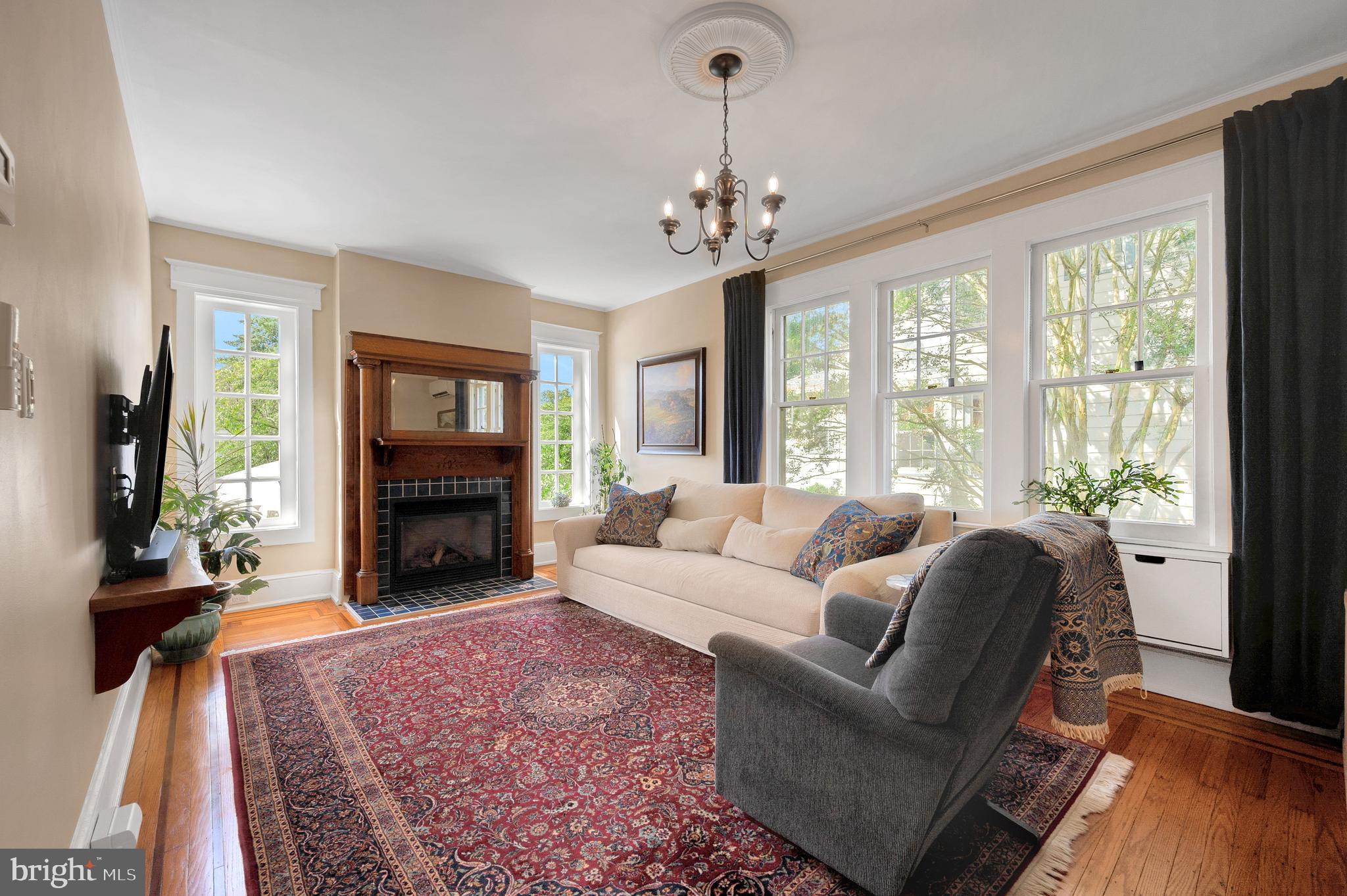 35 Harvard Road Audubon, NJ 08106 - Photo 10 of 36 a living room with furniture a fireplace and a flat screen tv
