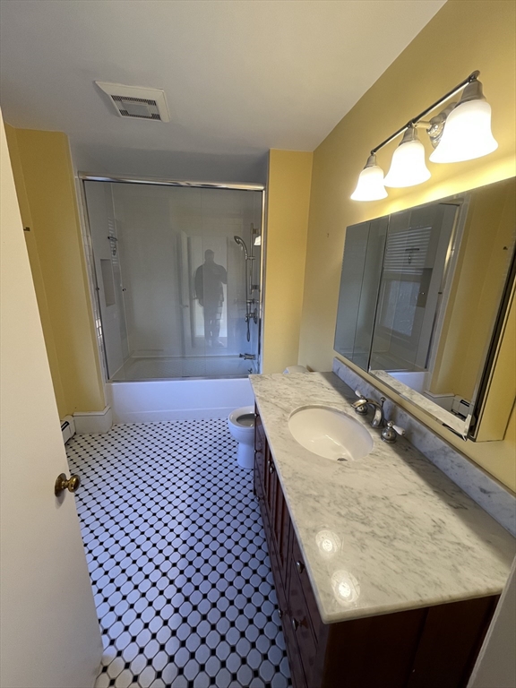 11 Revere Street, Unit 6 Boston, MA 02130 - Photo 11 of 32 a bathroom with a sink and a mirror