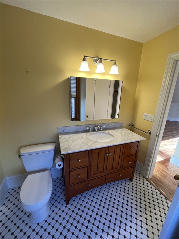 11 Revere Street, Unit 6 Boston, MA 02130 - Photo 12 of 32 a bathroom with a sink and a mirror