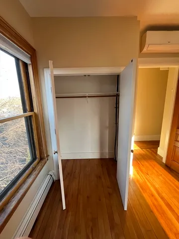 a view of front door and wooden floor