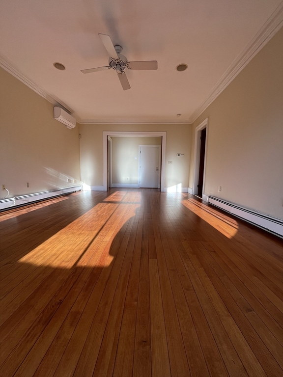 11 Revere Street, Unit 6 Boston, MA 02130 - Photo 21 of 32 a room with a bed and wooden floor