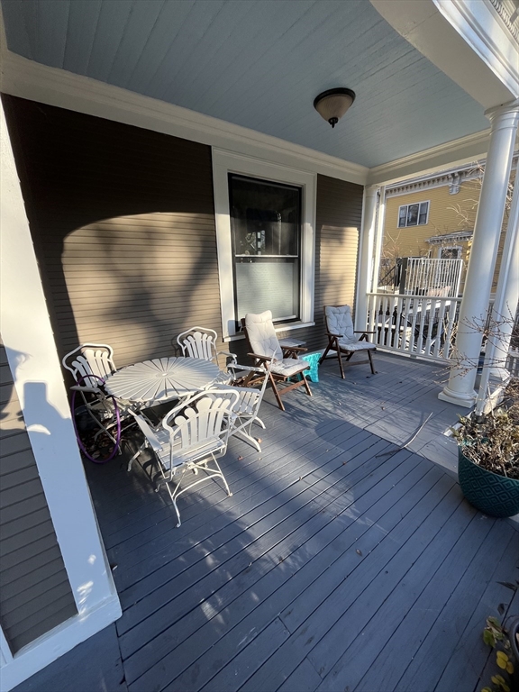11 Revere Street, Unit 6 Boston, MA 02130 - Photo 3 of 32 a living room with furniture and a wooden floor