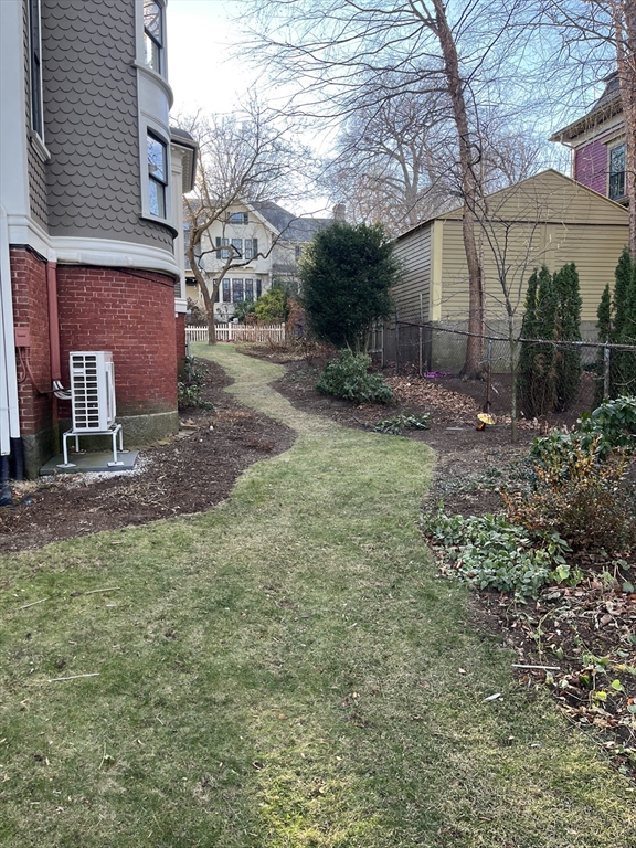11 Revere Street, Unit 6 Boston, MA 02130 - Photo 31 of 32 a view of a yard in front of a house