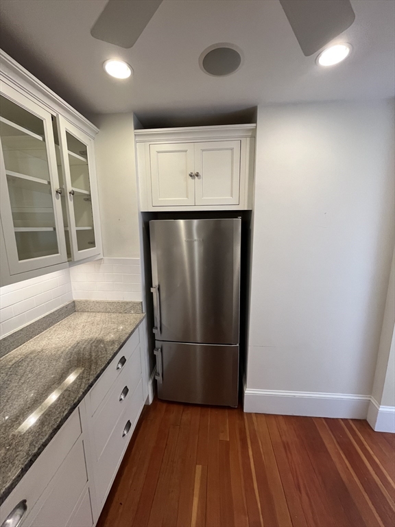 11 Revere Street, Unit 6 Boston, MA 02130 - Photo 10 of 32 a kitchen with granite countertop a refrigerator and a sink
