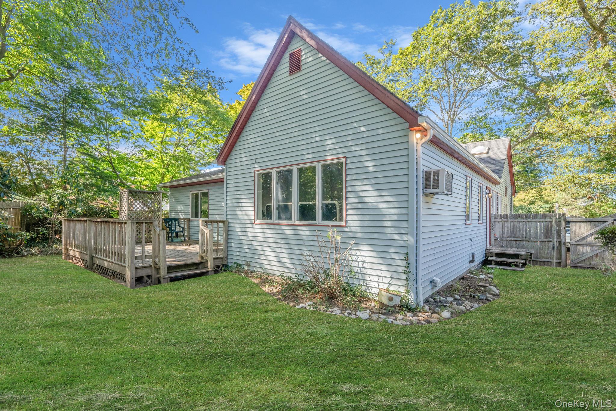 60 Hawthorne Road Rocky Point, NY 11778 - Photo 20 of 23 View of side of home featuring a deck
