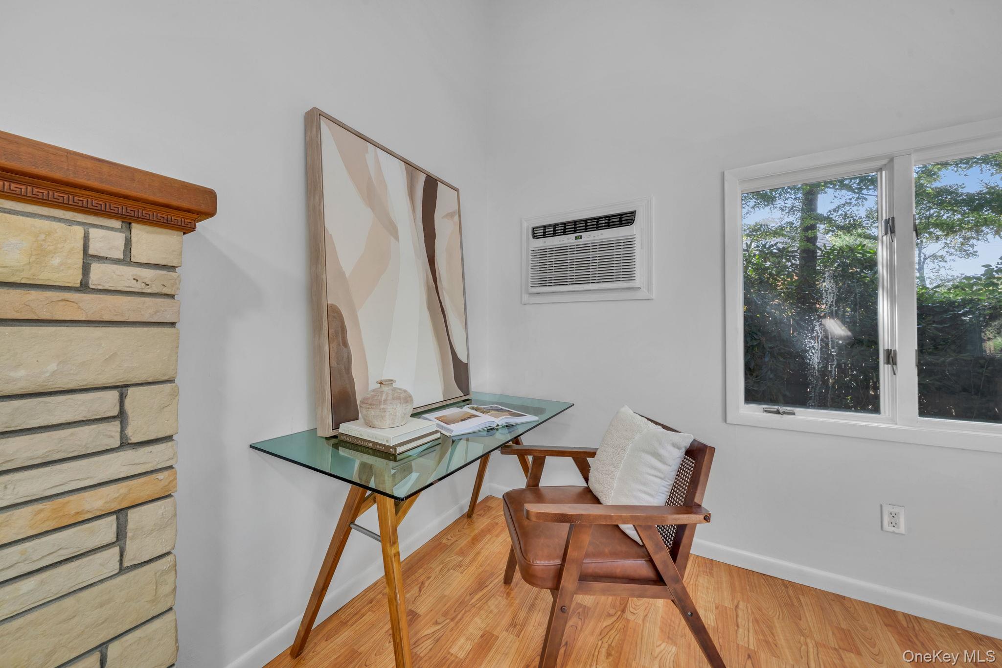 60 Hawthorne Road Rocky Point, NY 11778 - Photo 3 of 23 Office area with light wood-style floors and a wall mounted air conditioner