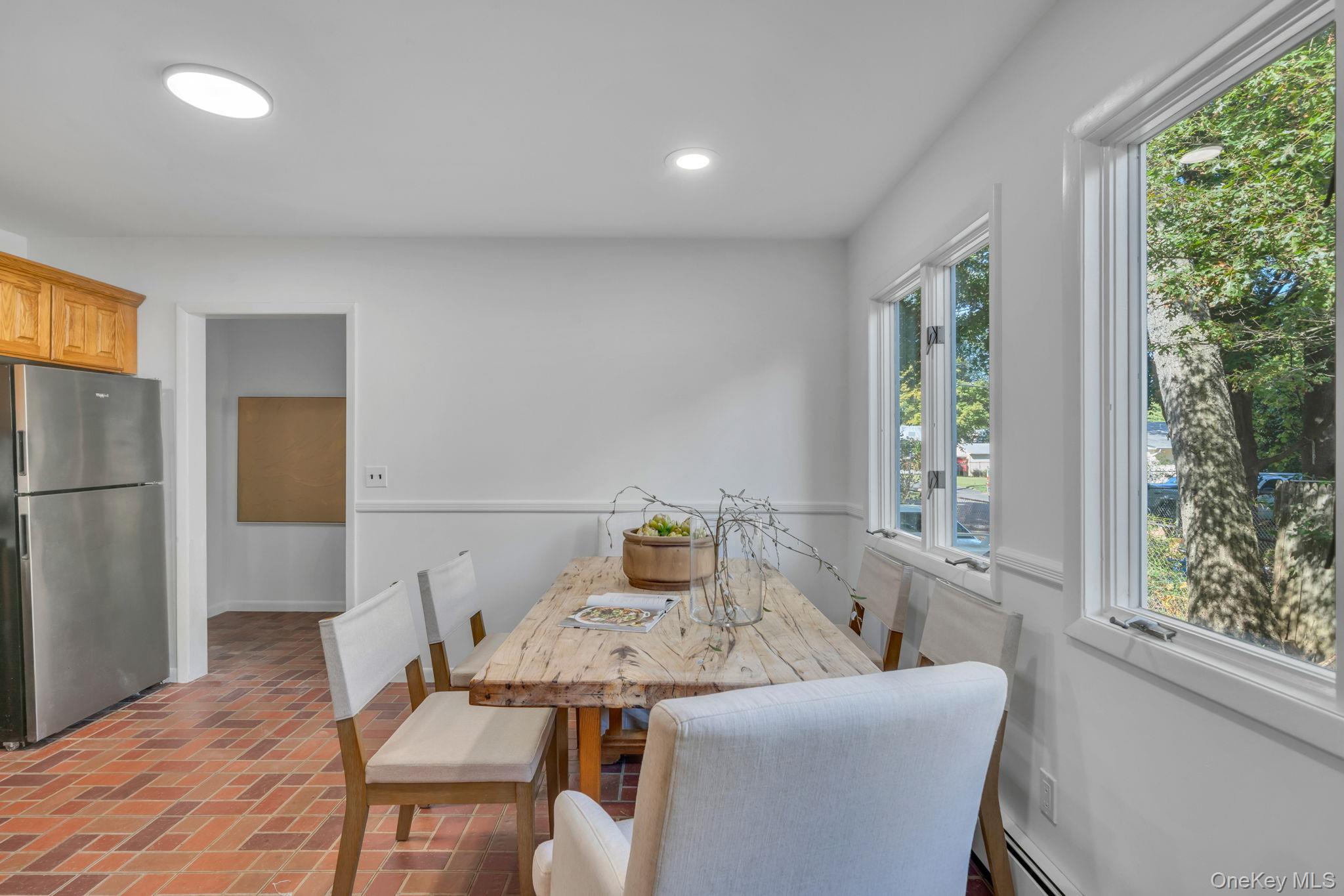 60 Hawthorne Road Rocky Point, NY 11778 - Photo 4 of 23 Dining area with brick floors, recessed lighting, and baseboard heating