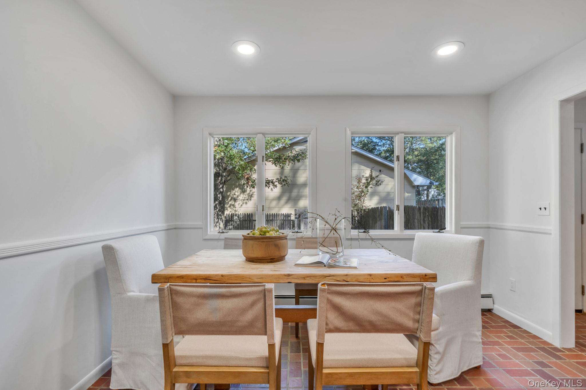 60 Hawthorne Road Rocky Point, NY 11778 - Photo 5 of 23 Dining space featuring brick floors, healthy amount of natural light, and recessed lighting