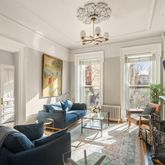 a living room with fireplace furniture and a flat screen tv