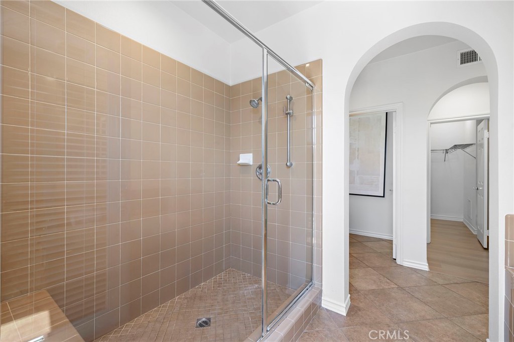 47 Tuscany Ladera Ranch, CA 92694 - Photo 18 of 28 a bathroom with a shower and a sink
