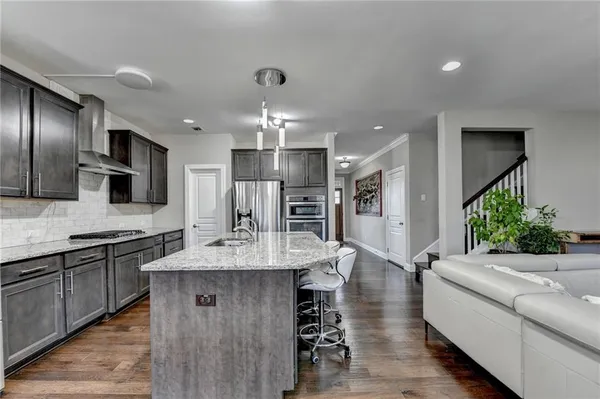 a kitchen with a stove microwave and refrigerator