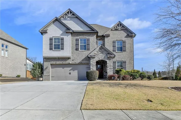 front view of a house with a yard