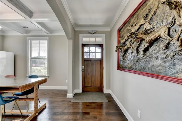 a view of a hallway with furniture and window