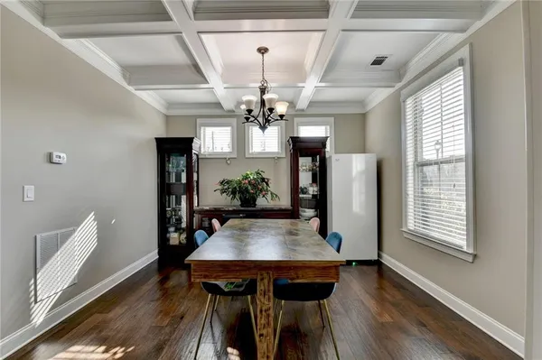 a view of a dining room with furniture and window