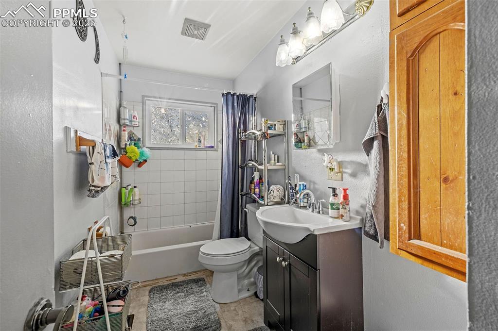 26 Easy Street Colorado Springs, CO 80911 - Photo 13 of 19 a bathroom with a sink toilet and shower