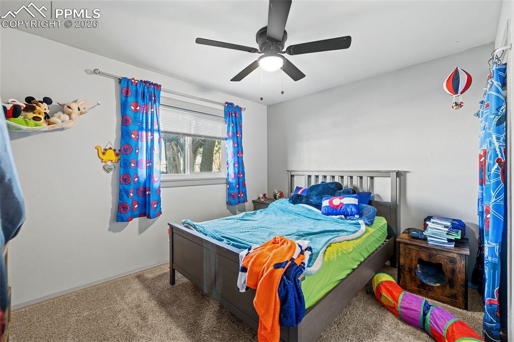 26 Easy Street Colorado Springs, CO 80911 - Photo 15 of 19 a bedroom with bed and dresser