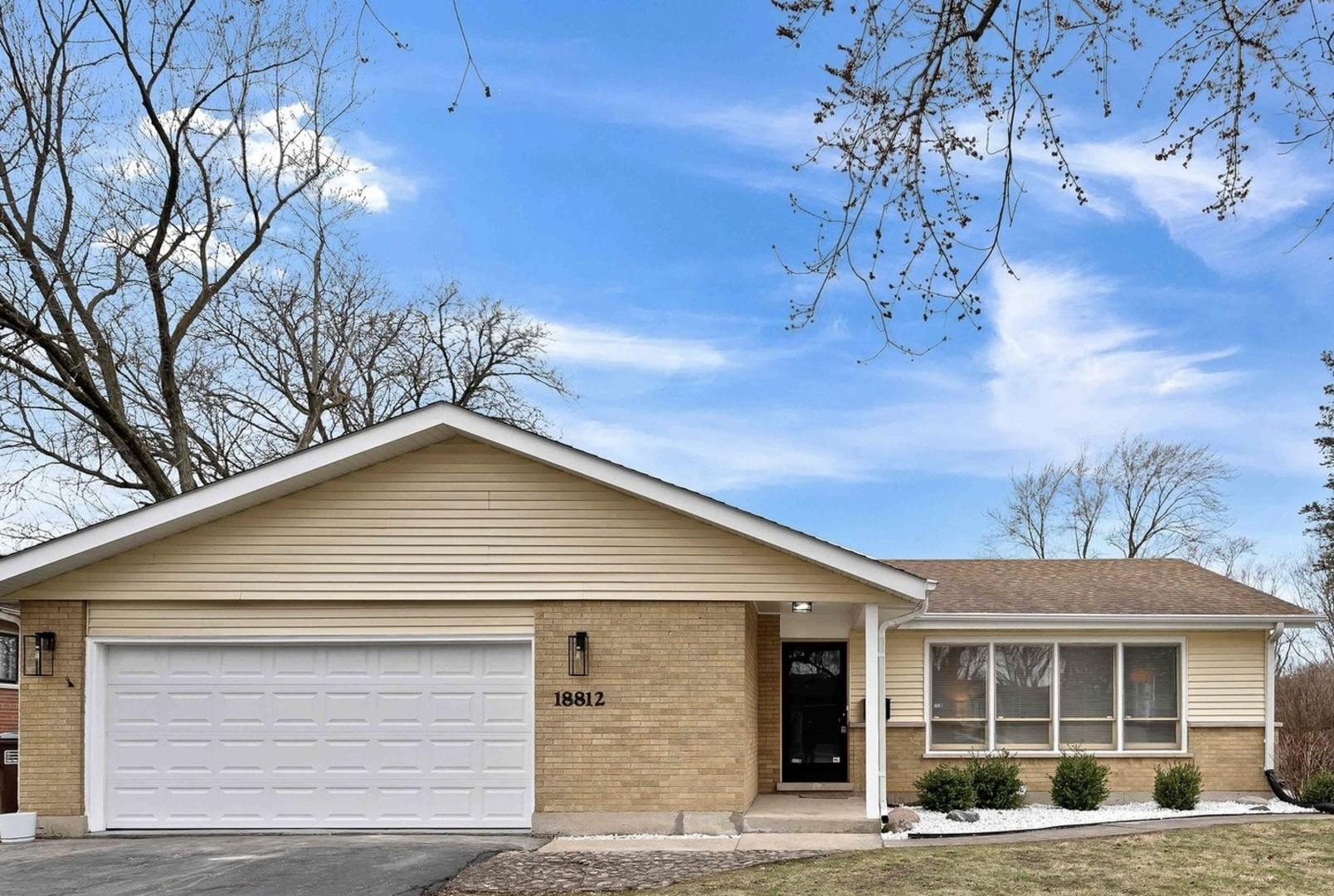 a front view of a house with a yard