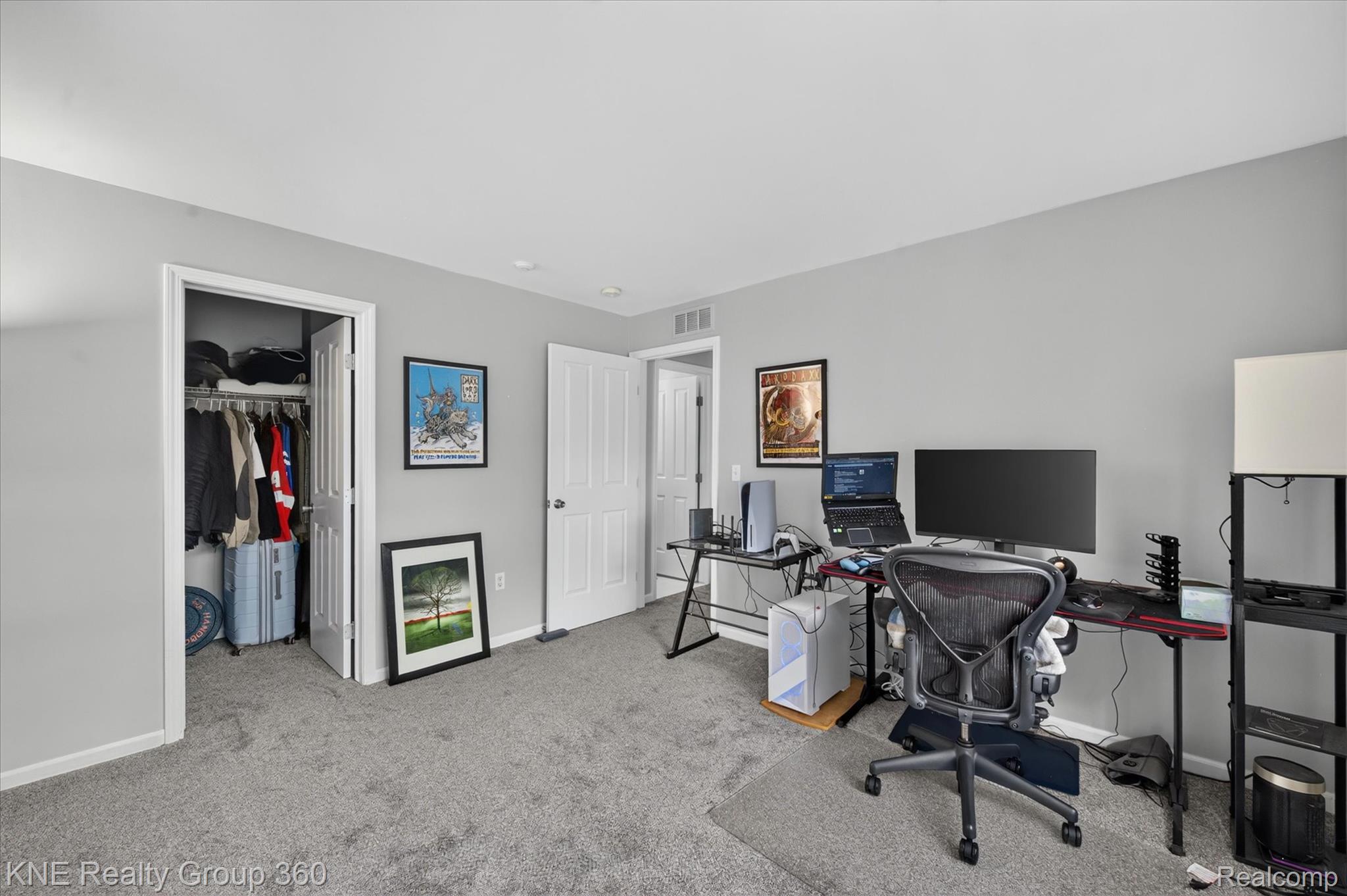 4077 Berkeley Avenue Canton, MI 48188 - Photo 24 of 32 Carpeted room featuring light gray walls, a built-in closet with an interior hanging rod, and white trim