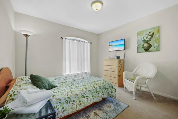 a bedroom with a bed and furniture